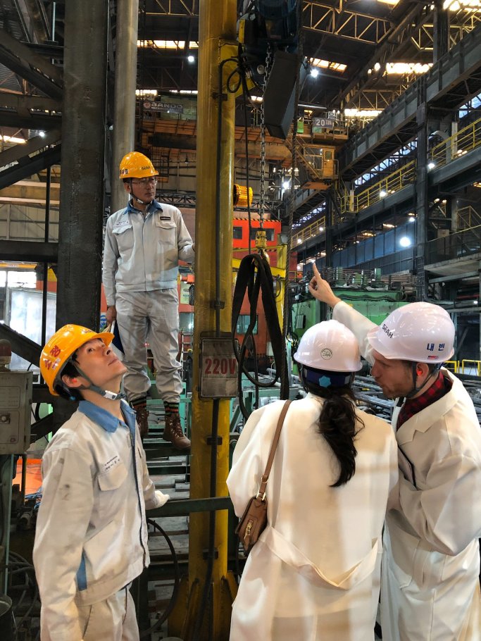 On a SeAH factory floor in Korea with plant staff